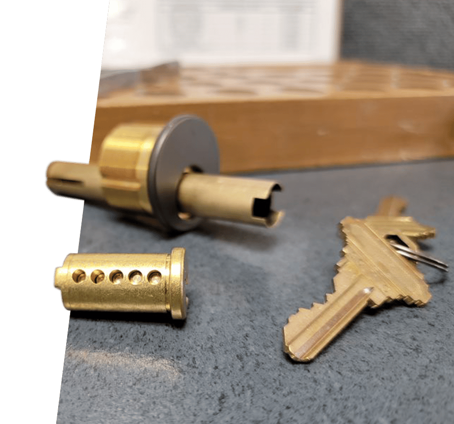 Lock Disassembled On Desk With Keys
